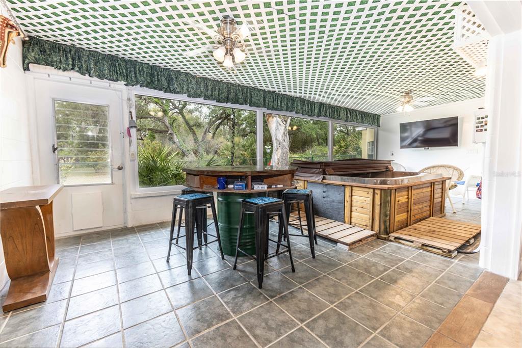 5175 Azalea Circle Dade City, FL 33523 - Photo 14 of 34 a view of a dining room with furniture window and outside view