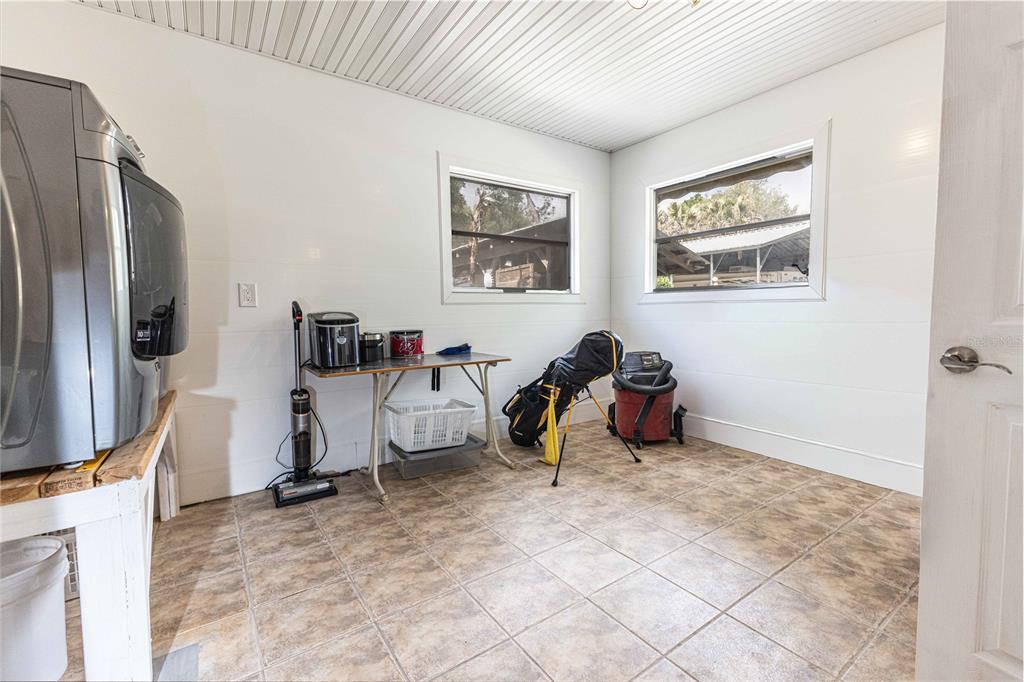 5175 Azalea Circle Dade City, FL 33523 - Photo 17 of 34 a view of a livingroom with workspace and a window