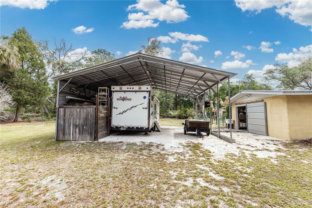 5175 Azalea Circle Dade City, FL 33523 - Photo 19 of 34 a view of a car park in front of house