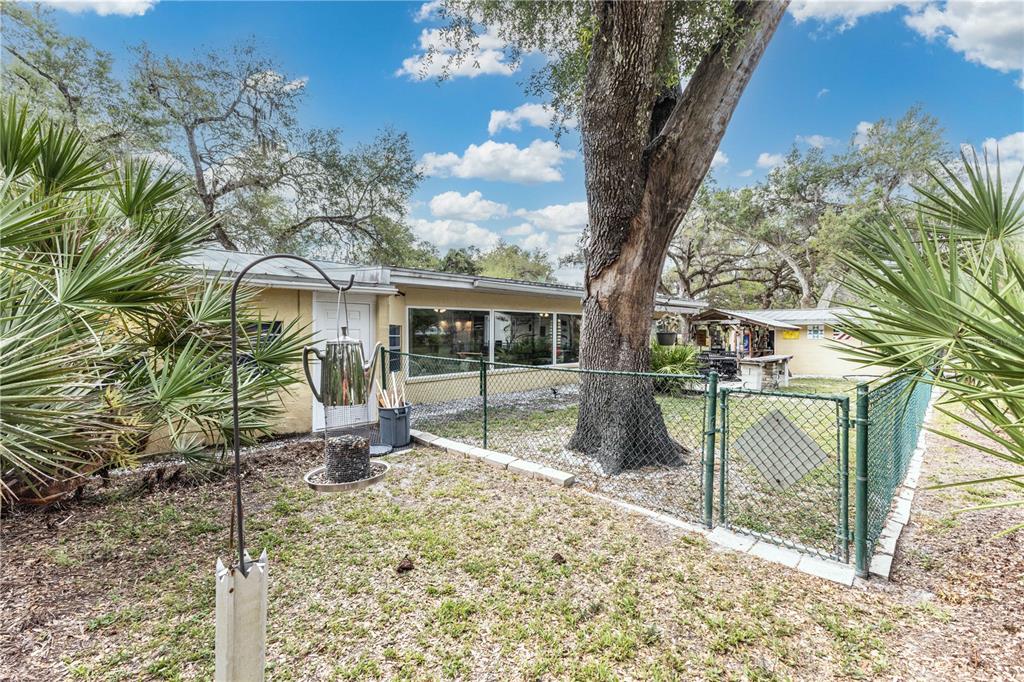 5175 Azalea Circle Dade City, FL 33523 - Photo 28 of 34 a house view with a backyard space