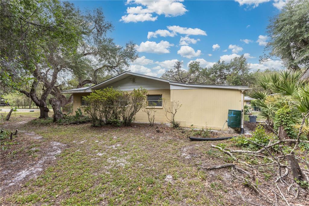 5175 Azalea Circle Dade City, FL 33523 - Photo 29 of 34 a house with trees in the background