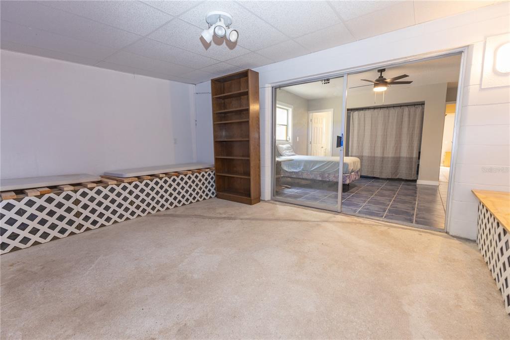 5175 Azalea Circle Dade City, FL 33523 - Photo 7 of 34 an empty room with furniture and windows
