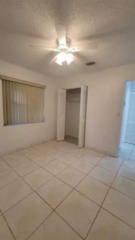 a view of an empty room and a window