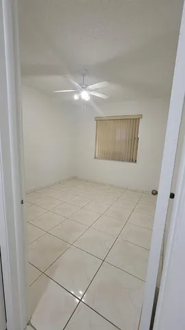 a bathroom with a toilet and a bathtub