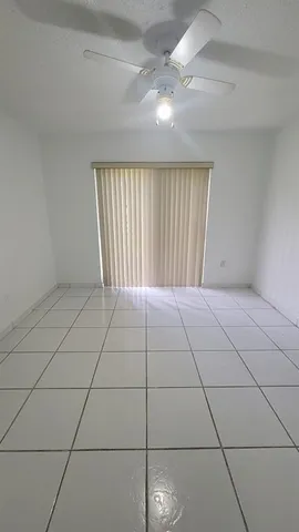 a view of an empty room and utility room