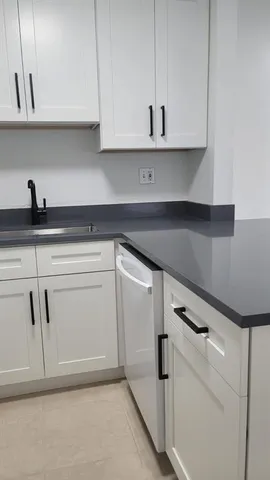 a view of a livingroom with an empty space and a window