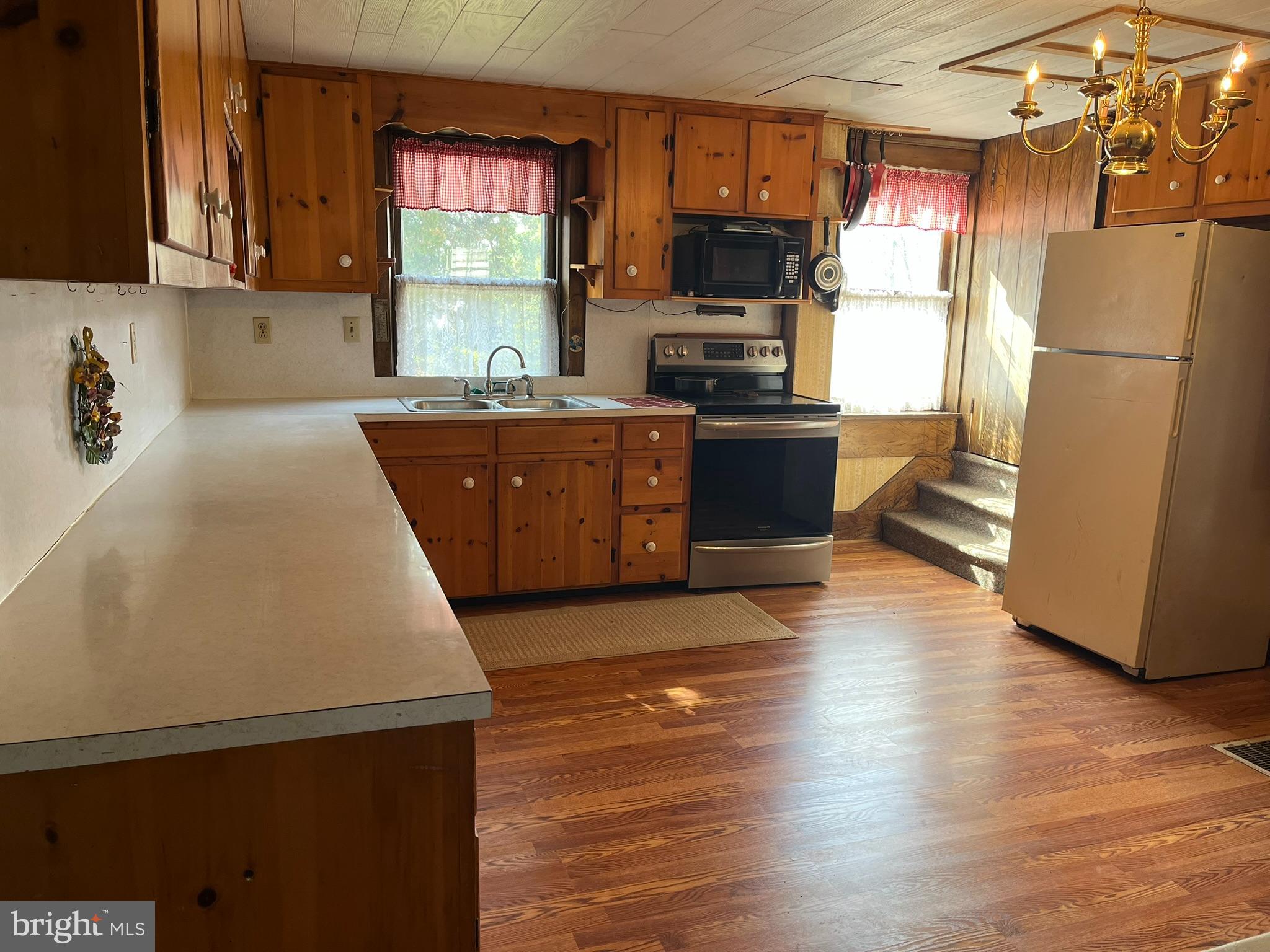4164 Penns Valley Road Spring Mills, PA 16875 - Photo 12 of 49 a kitchen with stainless steel appliances a refrigerator sink and microwave