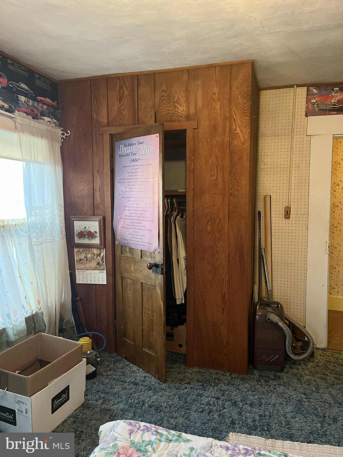 4164 Penns Valley Road Spring Mills, PA 16875 - Photo 17 of 34 a living room with a couch and a potted plant
