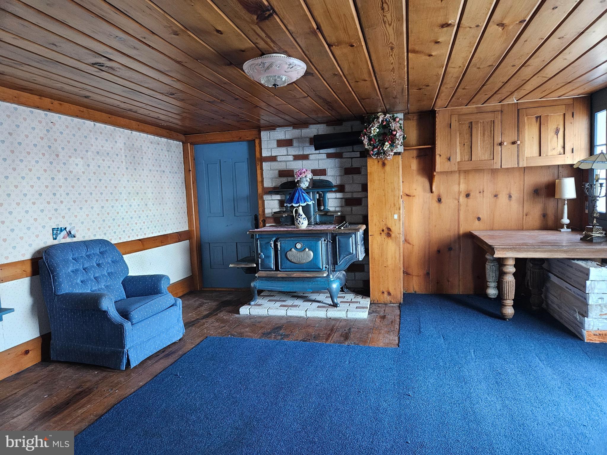 4164 Penns Valley Road Spring Mills, PA 16875 - Photo 25 of 49 a living room with furniture and a wooden floor