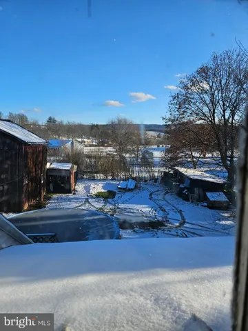 a view of a yard with an outdoor space