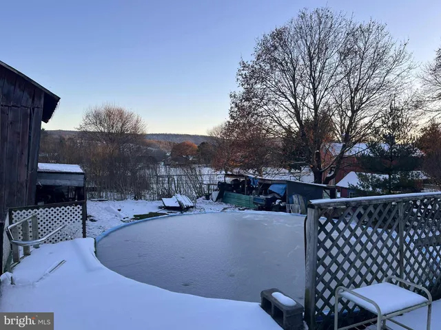 a view of a patio with a yard