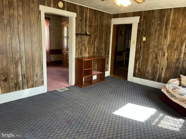 a room with wooden floor and furniture