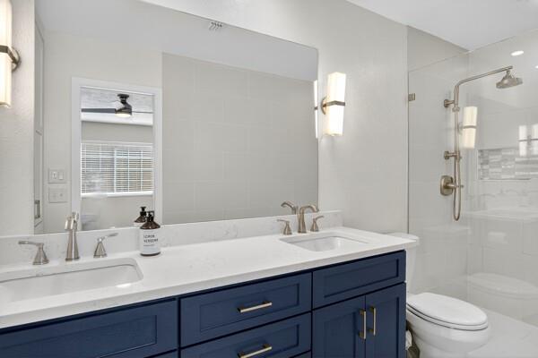 6331 North Jim Miller Road Dallas, TX 75228 - Photo 14 of 28 Full bath featuring double vanity and a shower stall