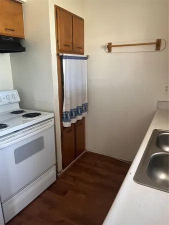 a view of a storage & utility room with a sink