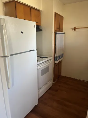 a white refrigerator freezer sitting inside of a kitchen
