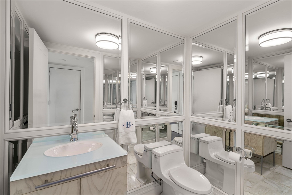 4 Battery Wharf, Unit 4604 Boston, MA 02109 - Photo 16 of 39 a bathroom with a sink and a mirror