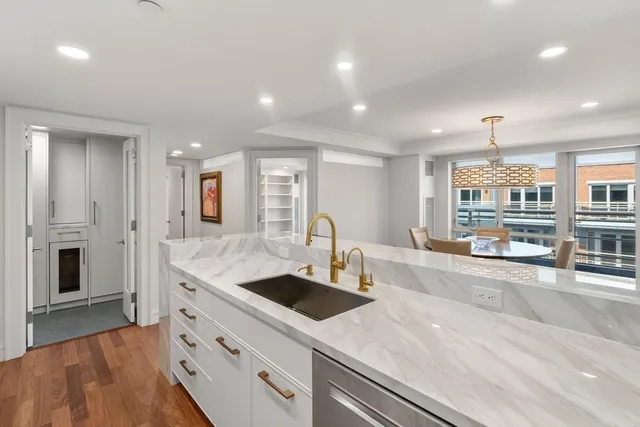 a bathroom with a glass shower door