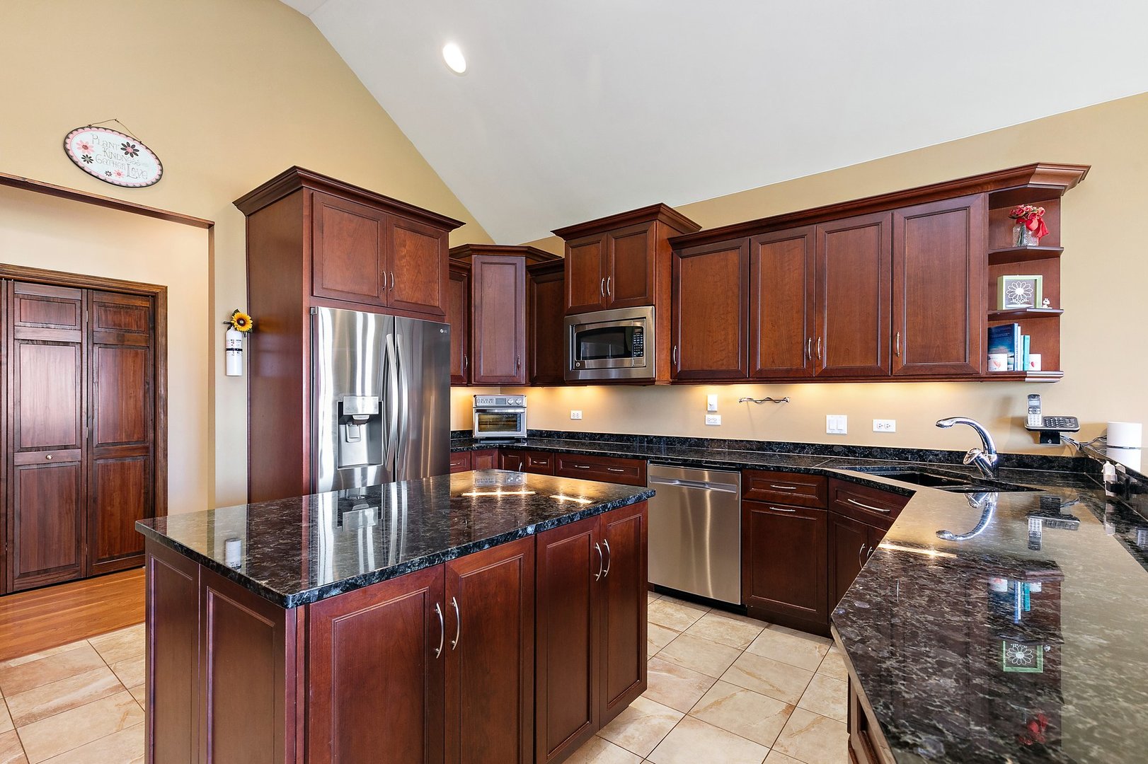 550 Maplewood Road Somonauk, IL 60552 - Photo 14 of 91 a kitchen with stainless steel appliances granite countertop a stove refrigerator and cabinets