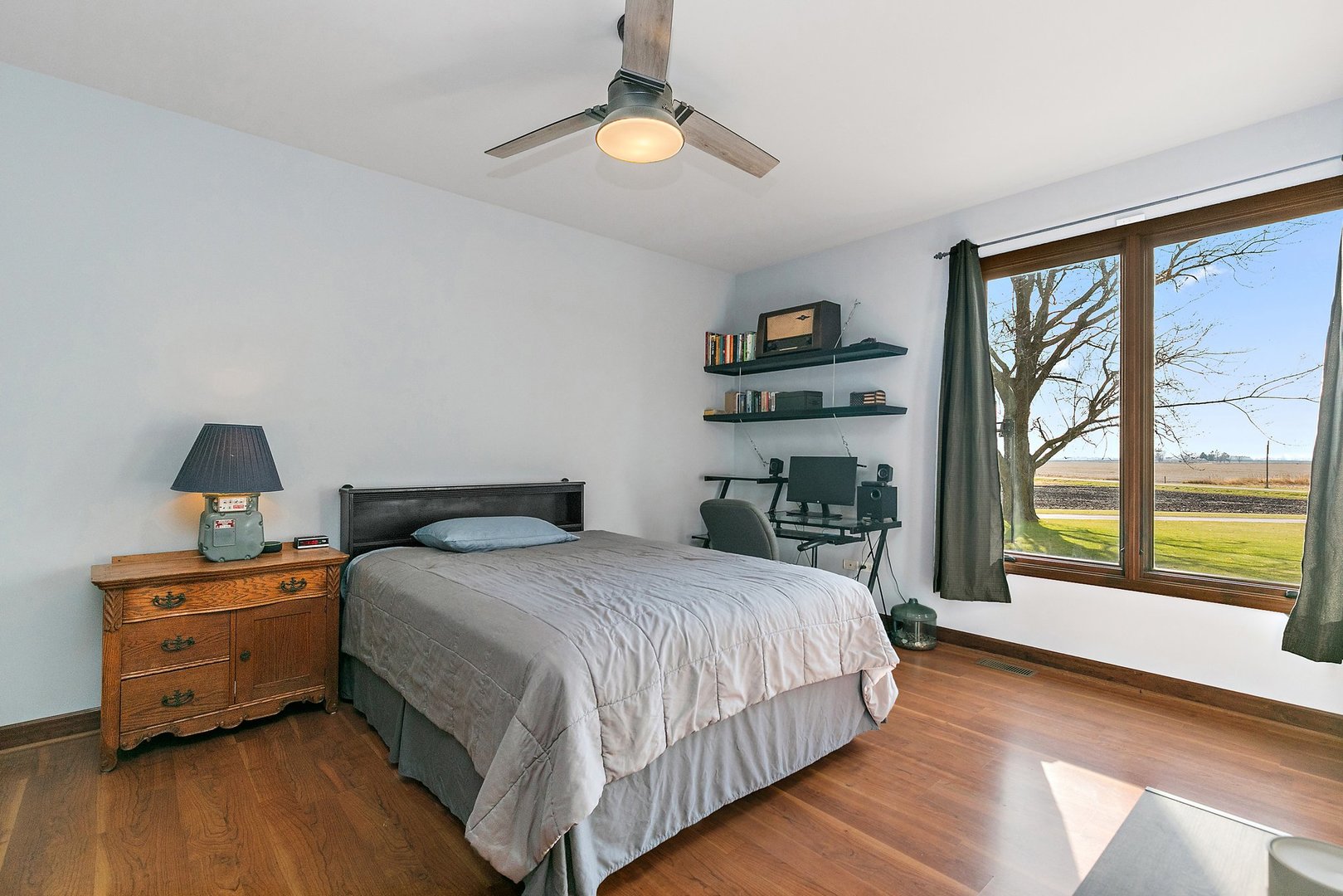 550 Maplewood Road Somonauk, IL 60552 - Photo 34 of 91 a bedroom with a large bed and a large window