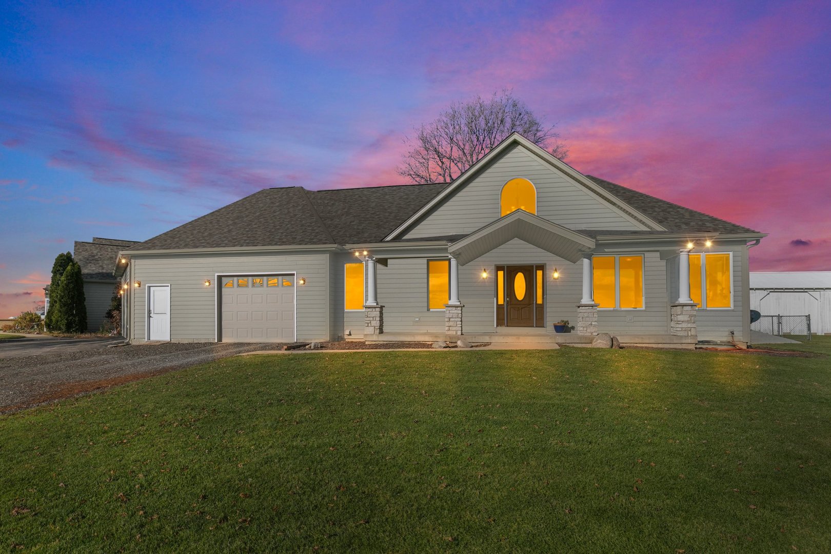 550 Maplewood Road Somonauk, IL 60552 - Photo 38 of 91 a view of a big house with a big yard and large trees