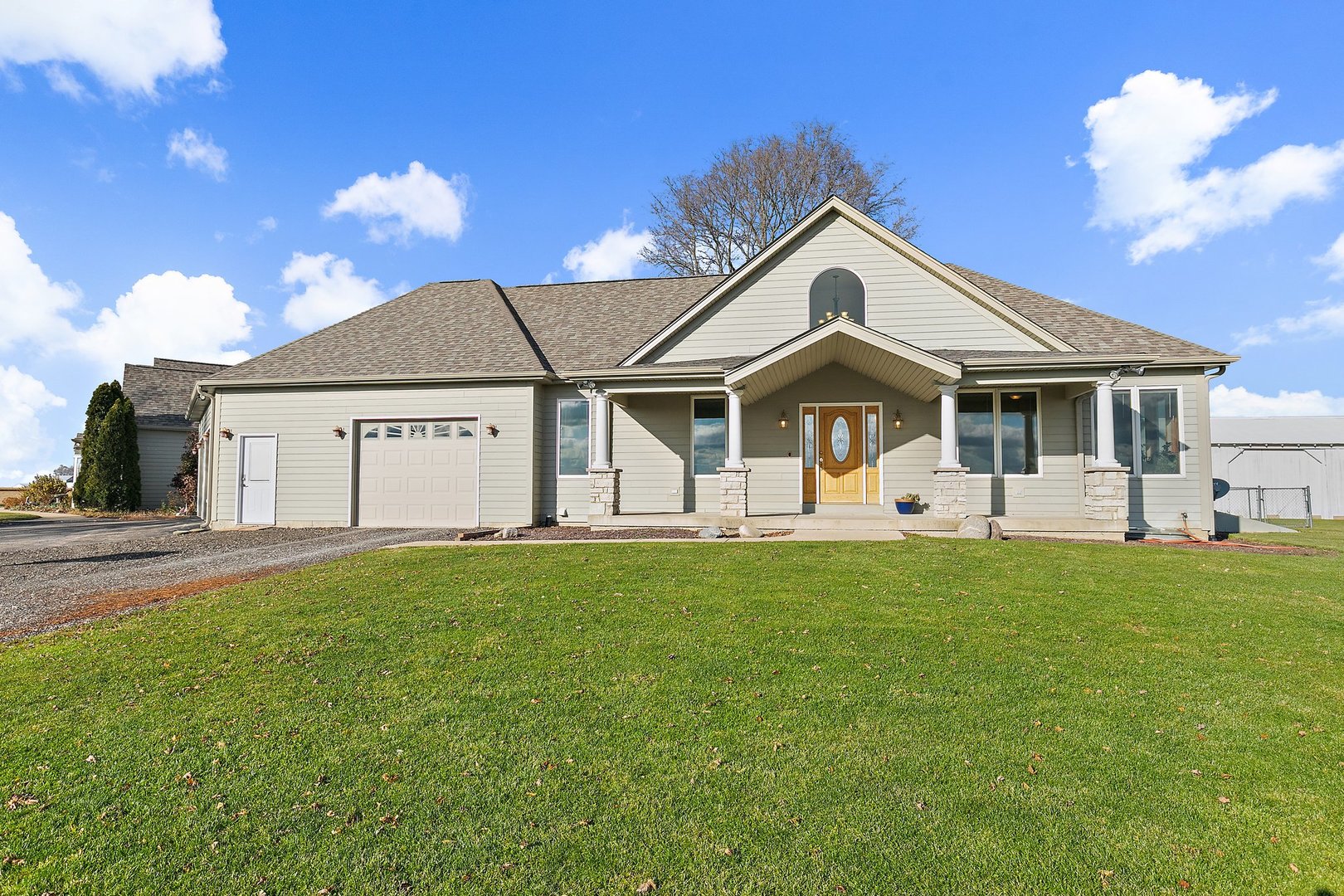550 Maplewood Road Somonauk, IL 60552 - Photo 39 of 91 a front view of a house with a garden