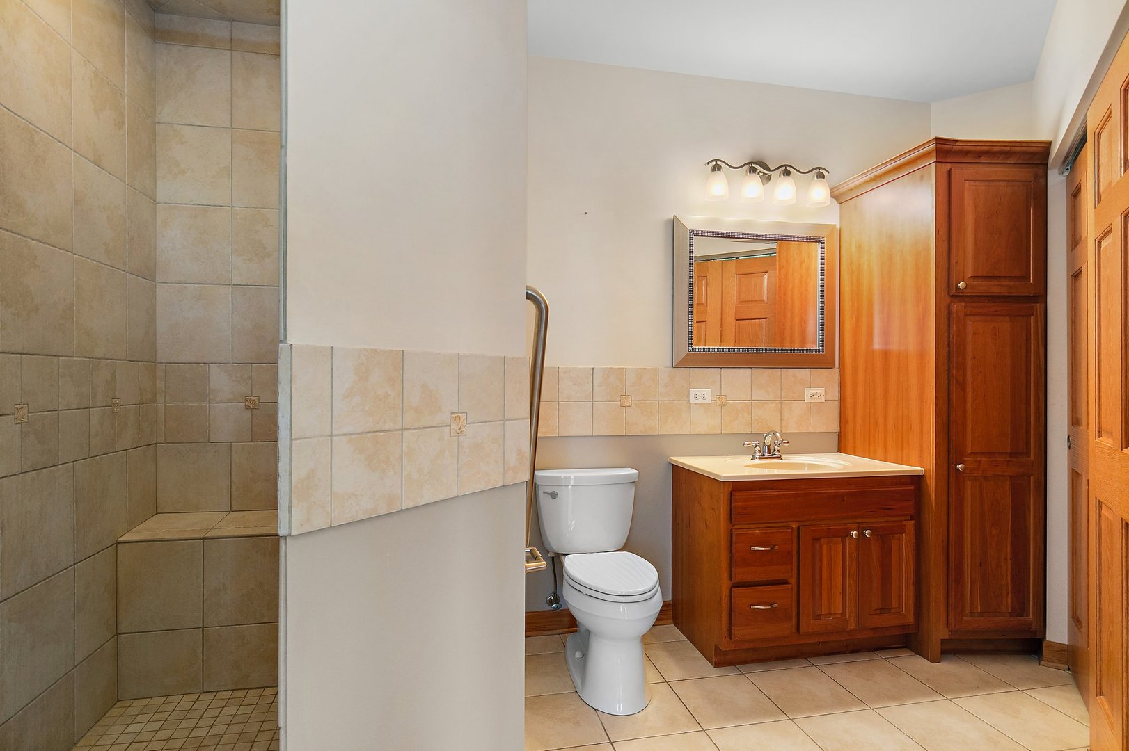 550 Maplewood Road Somonauk, IL 60552 - Photo 47 of 91 a bathroom with a toilet sink and mirror
