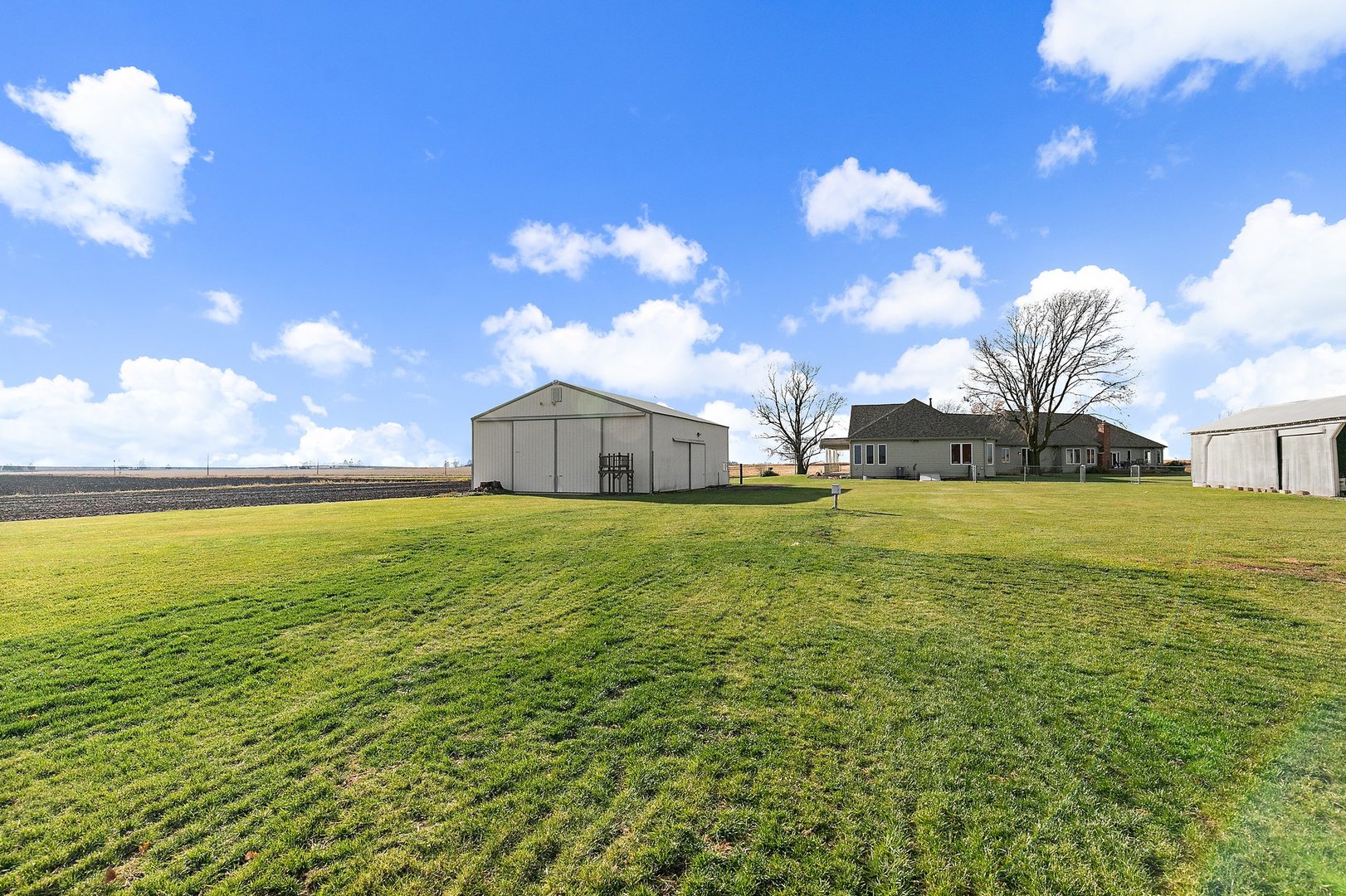 550 Maplewood Road Somonauk, IL 60552 - Photo 68 of 91 a house view with swimming pool in front of it