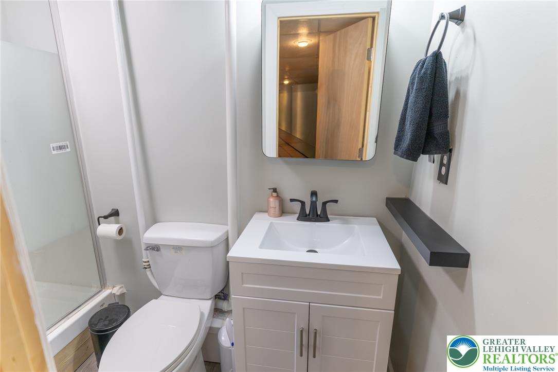 896 Briarstone Road Bethlehem, PA 18017 - Photo 22 of 26 a bathroom with a sink toilet and mirror