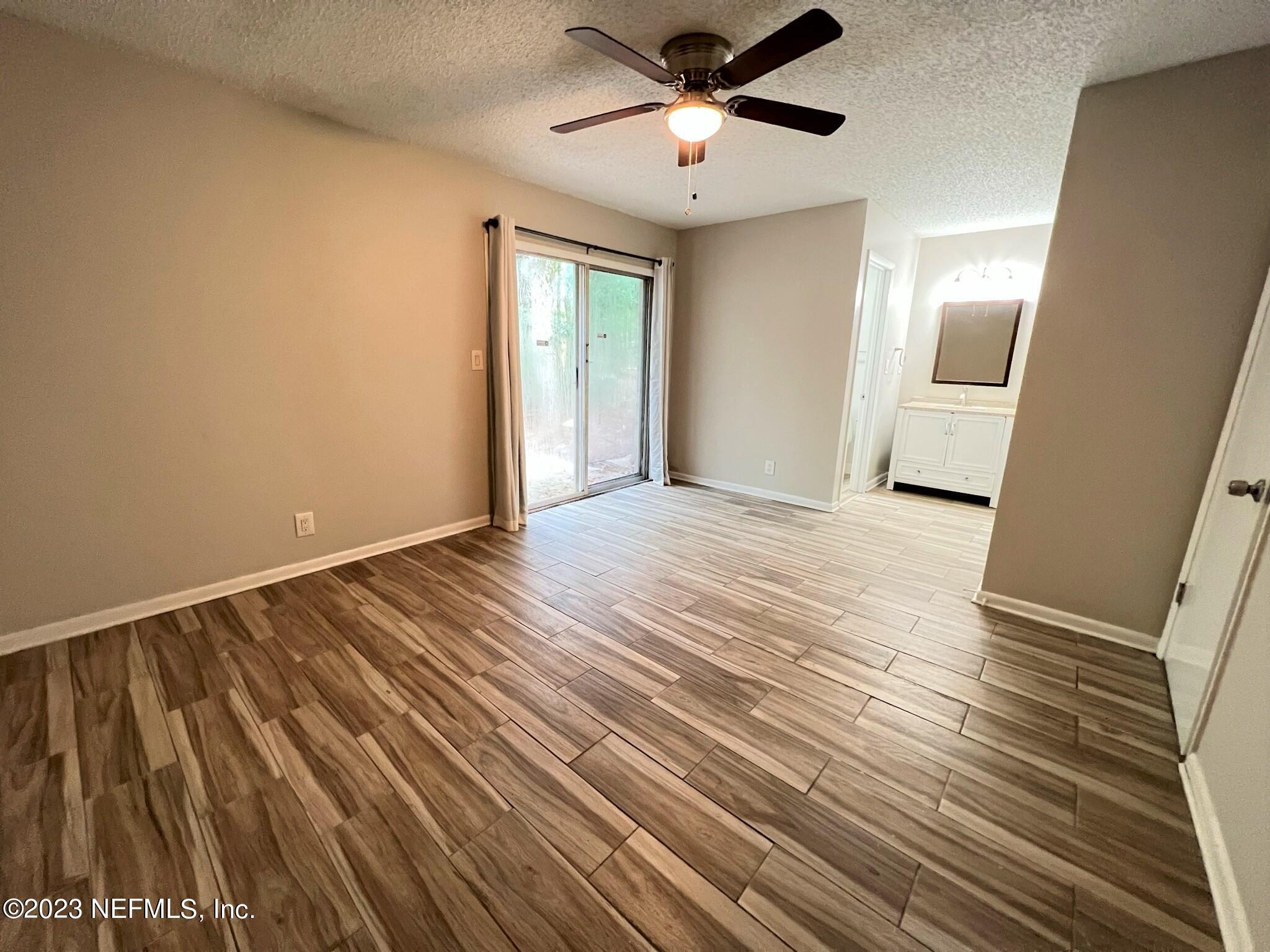 5404 101st Street, Unit 4 Jacksonville, FL 32210 - Photo 5 of 8 a view of an empty room with a window
