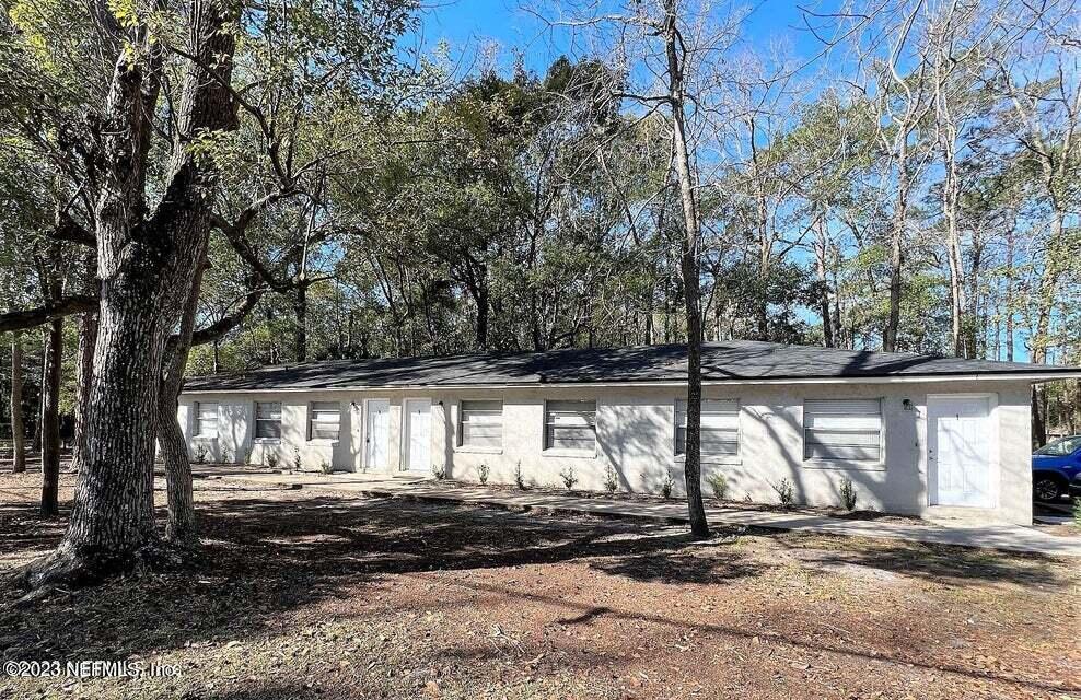 5404 101st Street, Unit 4 Jacksonville, FL 32210 - Photo 8 of 8 a view of a house with a street