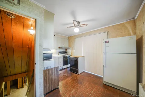 a view of a kitchen with a microwave and a stove