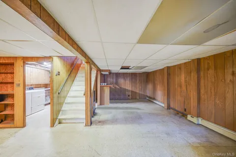a view of an empty room with stairs