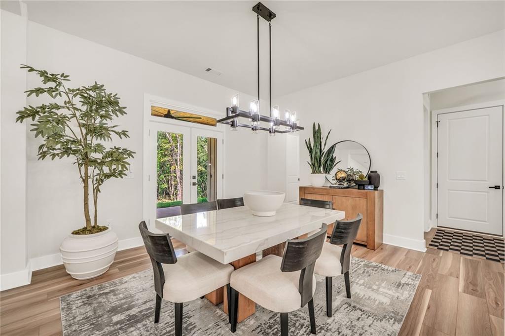 5567 Tyree Road Winston, GA 30187 - Photo 5 of 28 a view of a dining room with furniture window and wooden floor