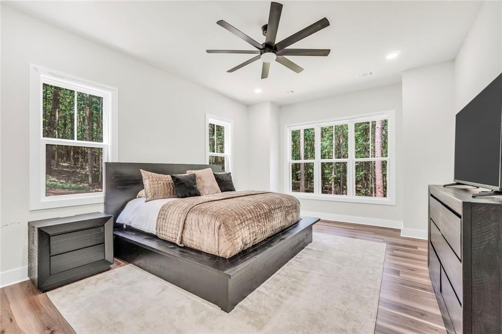 5567 Tyree Road Winston, GA 30187 - Photo 9 of 28 a spacious bedroom with a bed and a large window