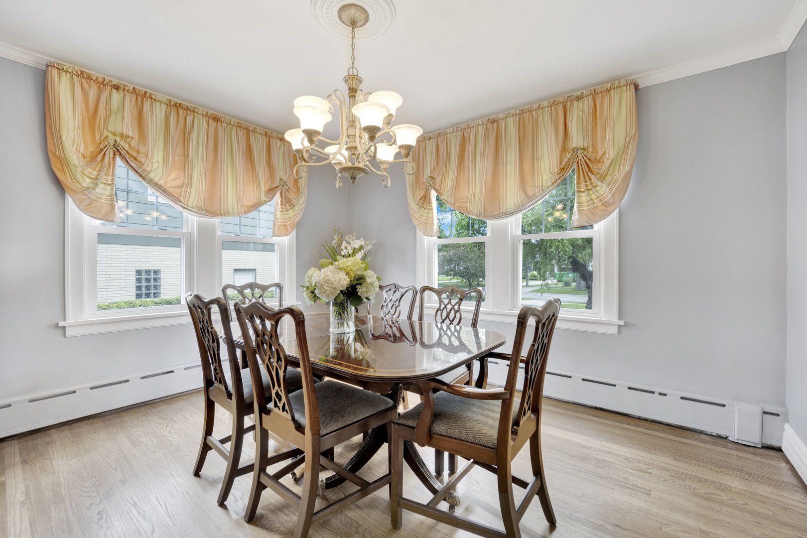166 South Delaplaine Road Riverside, IL 60546 - Photo 10 of 41 a view of a dining room with furniture a chandelier and wooden floor