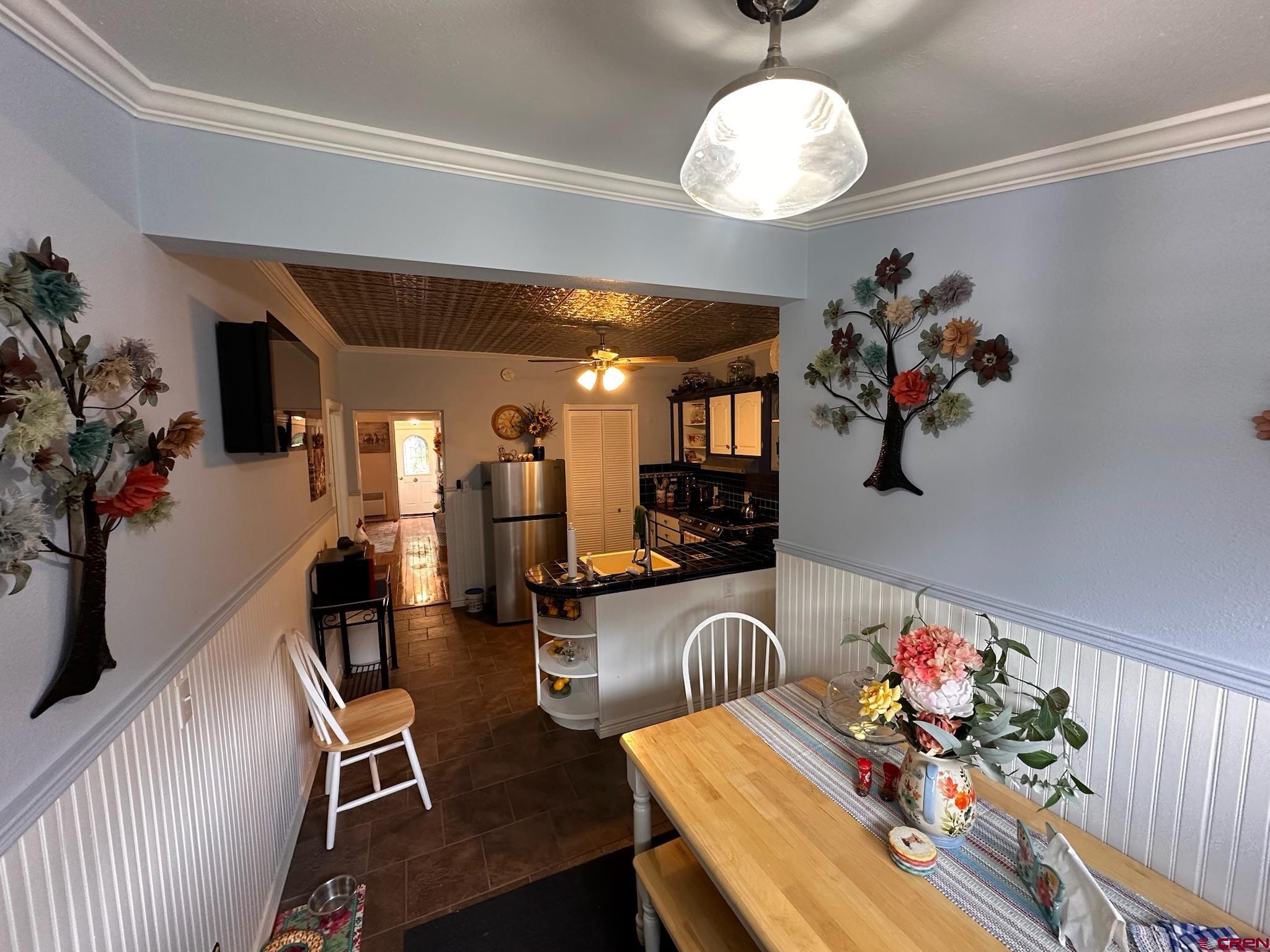 1250 Snowden Street Silverton, CO 81433 - Photo 20 of 34 a view of a dining room with furniture and wooden floor