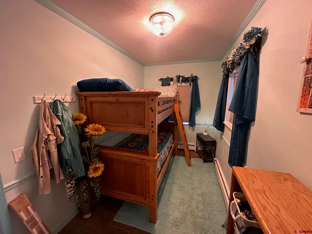 a view of a hallway with a flower pot