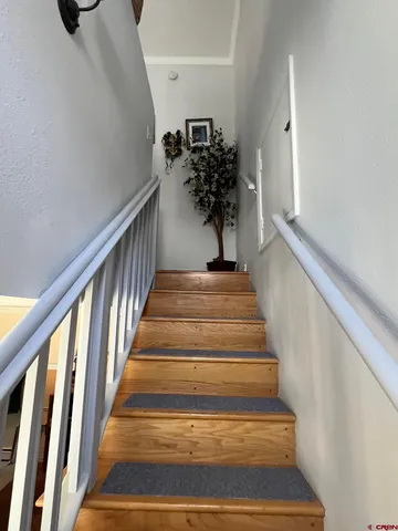 a bed sitting in a room next to a window