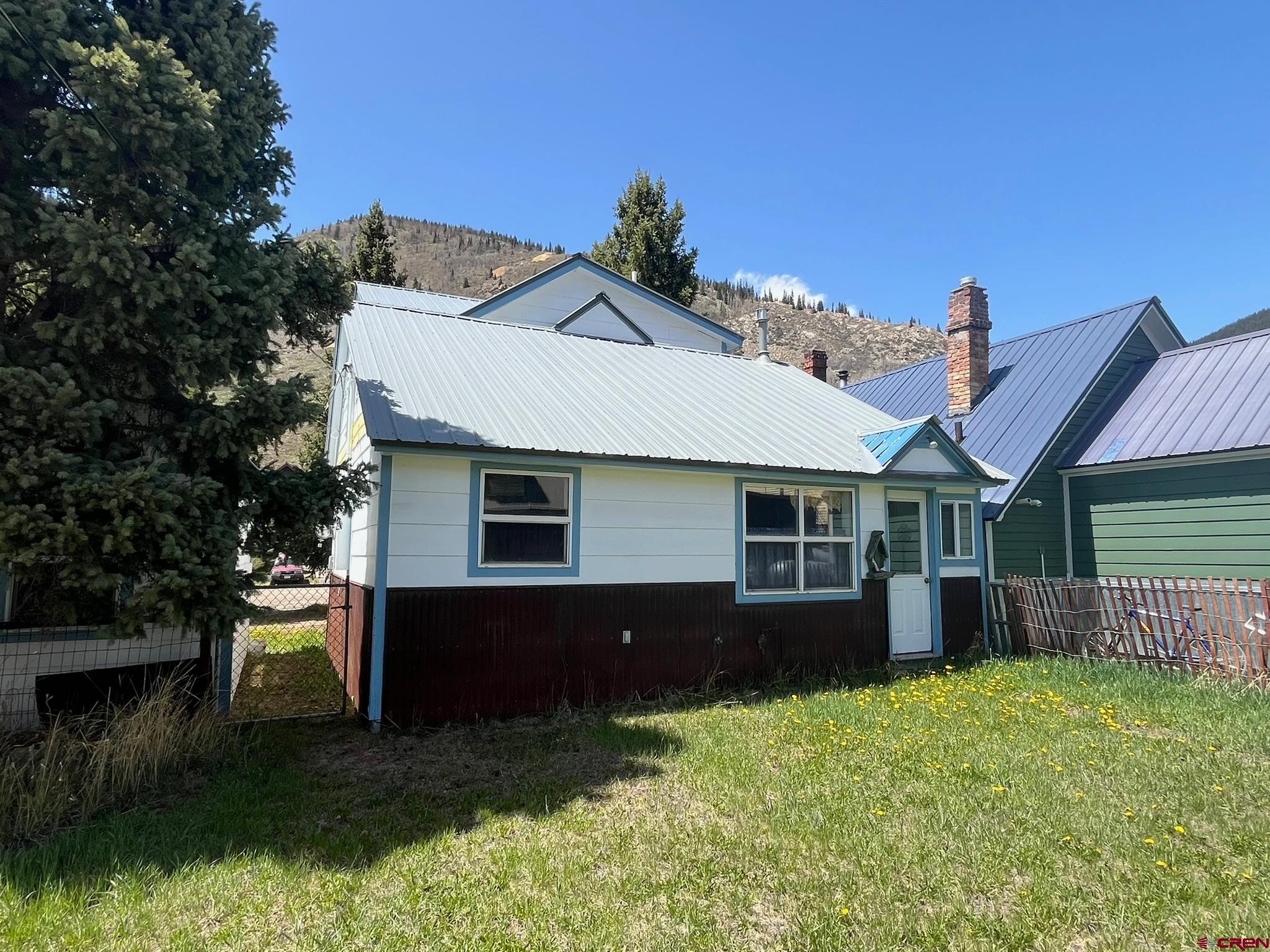 1250 Snowden Street Silverton, CO 81433 - Photo 3 of 34 a front view of a house with a yard