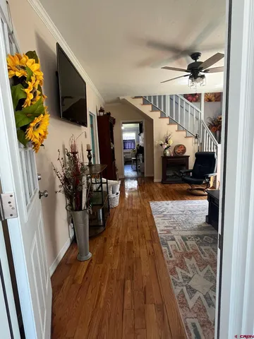 a view of living room with furniture and a flat screen tv