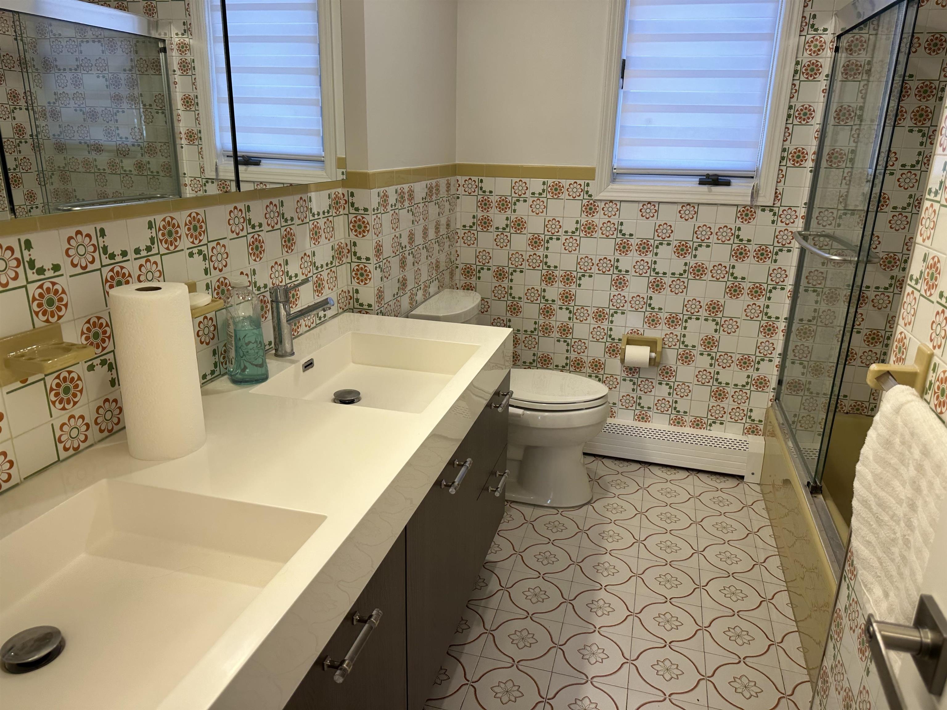 531 Day Avenue, Unit 1 Ridgefield, NJ 07657 - Photo 13 of 18 a bathroom with a sink and a toilet