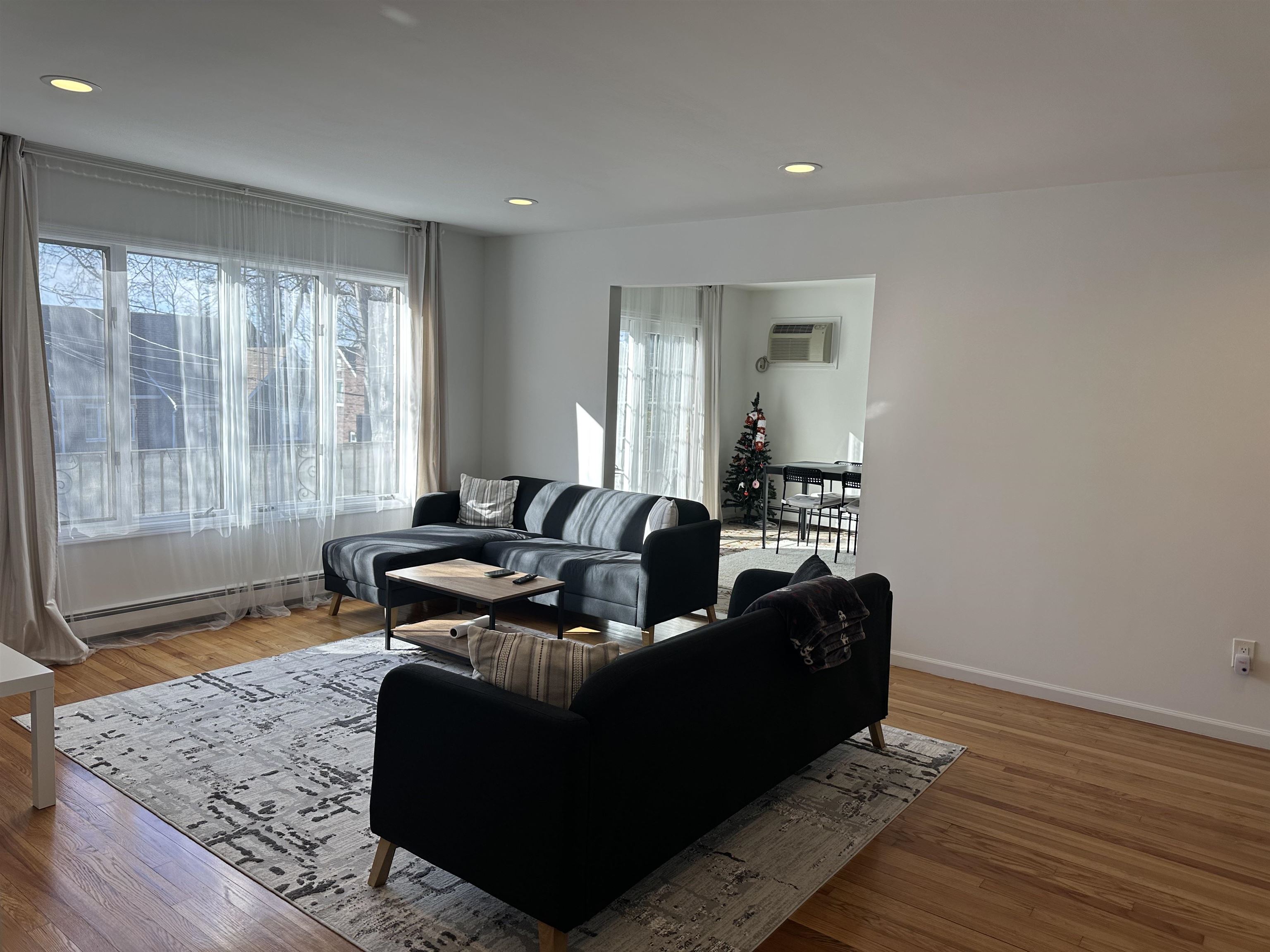 531 Day Avenue, Unit 1 Ridgefield, NJ 07657 - Photo 2 of 18 a living room with furniture and a window