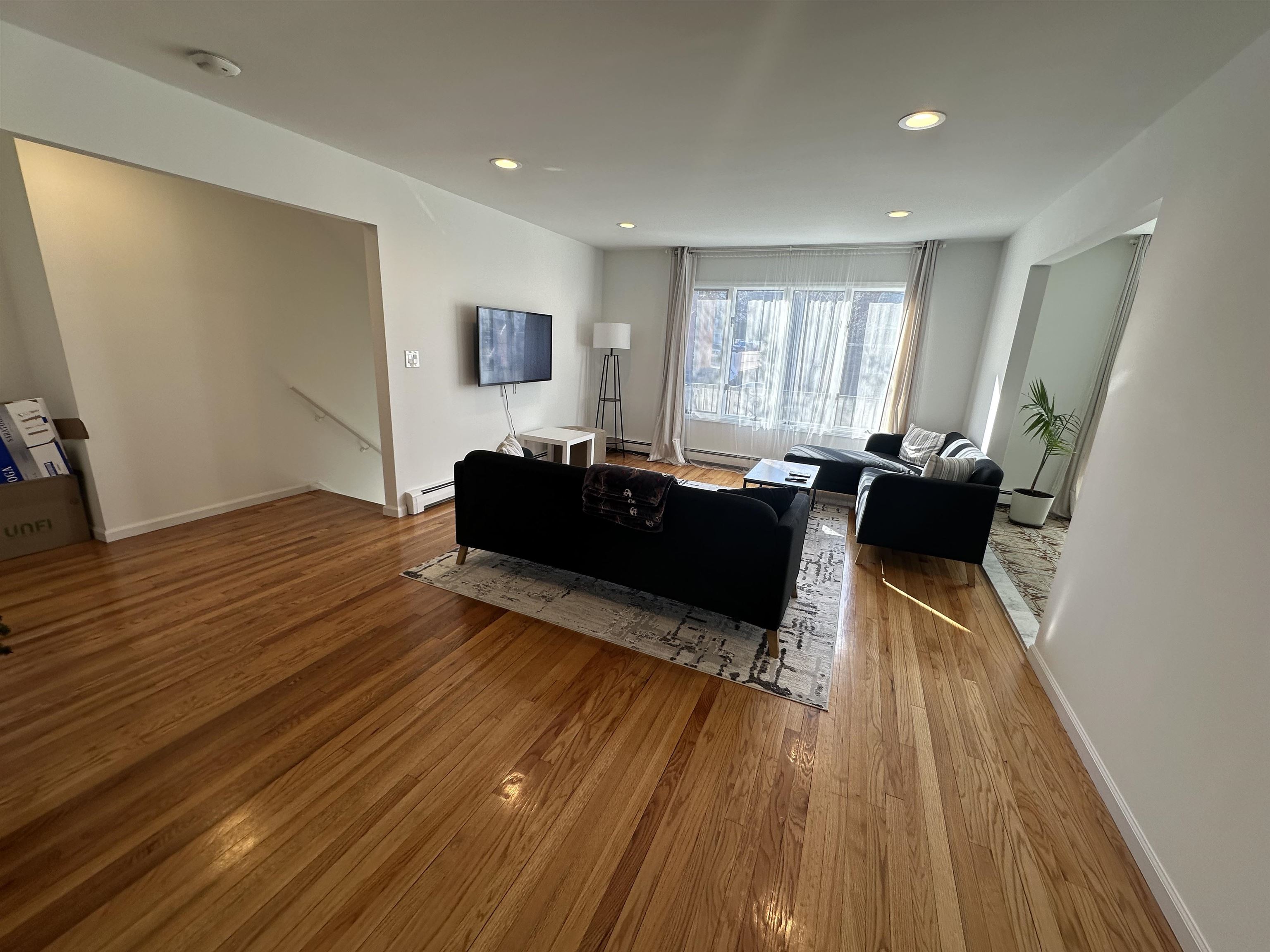 531 Day Avenue, Unit 1 Ridgefield, NJ 07657 - Photo 3 of 18 a living room with furniture and a wooden floor
