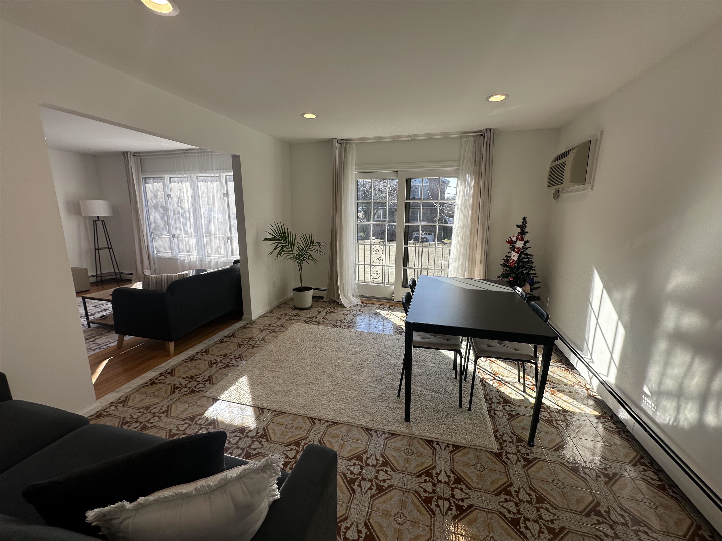 531 Day Avenue, Unit 1 Ridgefield, NJ 07657 - Photo 6 of 18 a living room with furniture and a flat screen tv
