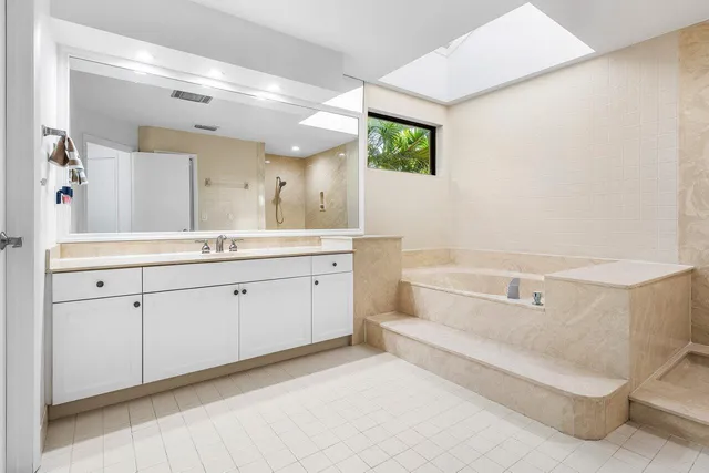 a bathroom with a bathtub and a sink