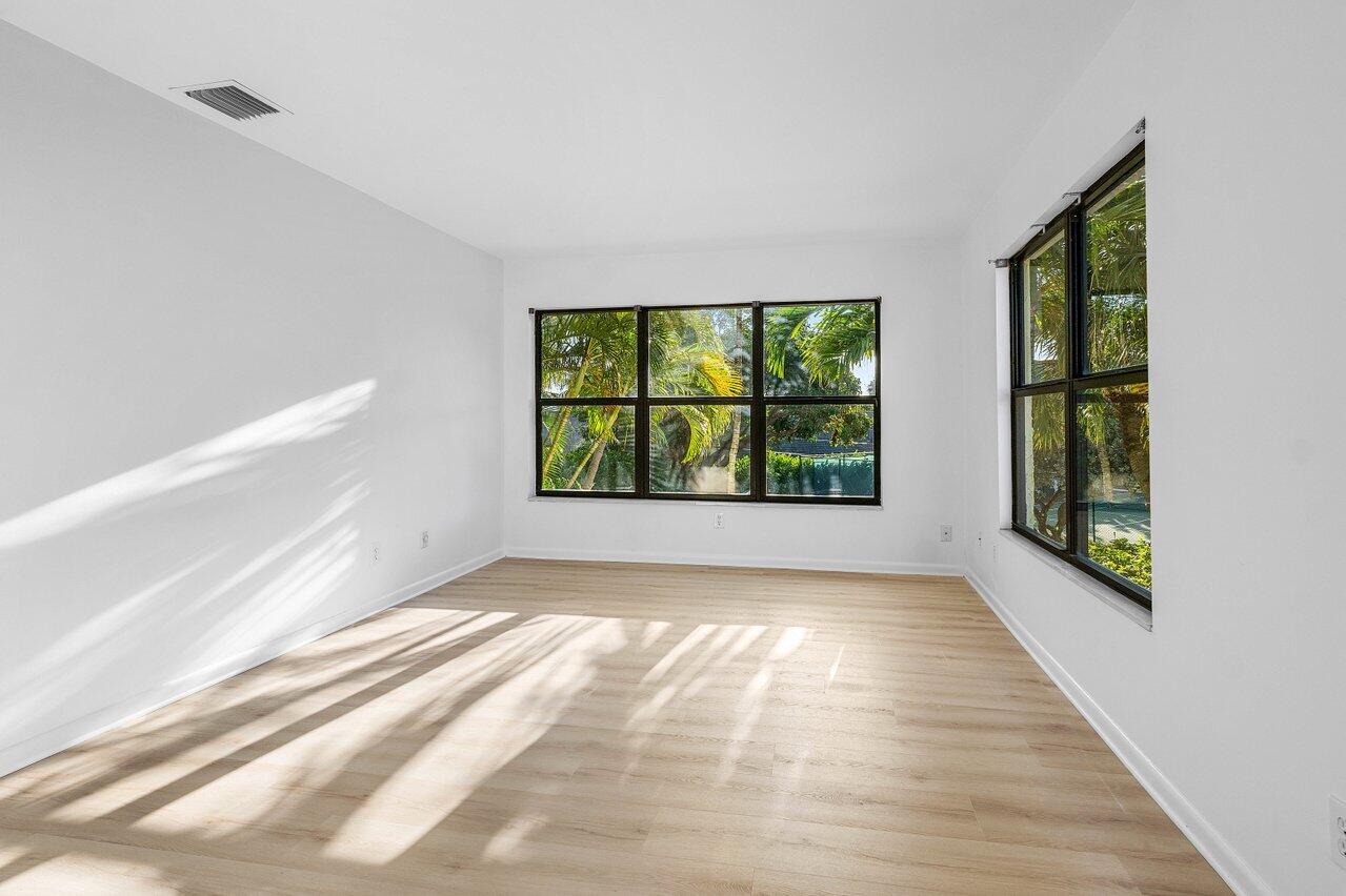 5109 North Ocean Boulevard, Unit H Ocean Ridge, FL 33435 - Photo 30 of 45 a view of an empty room with a window