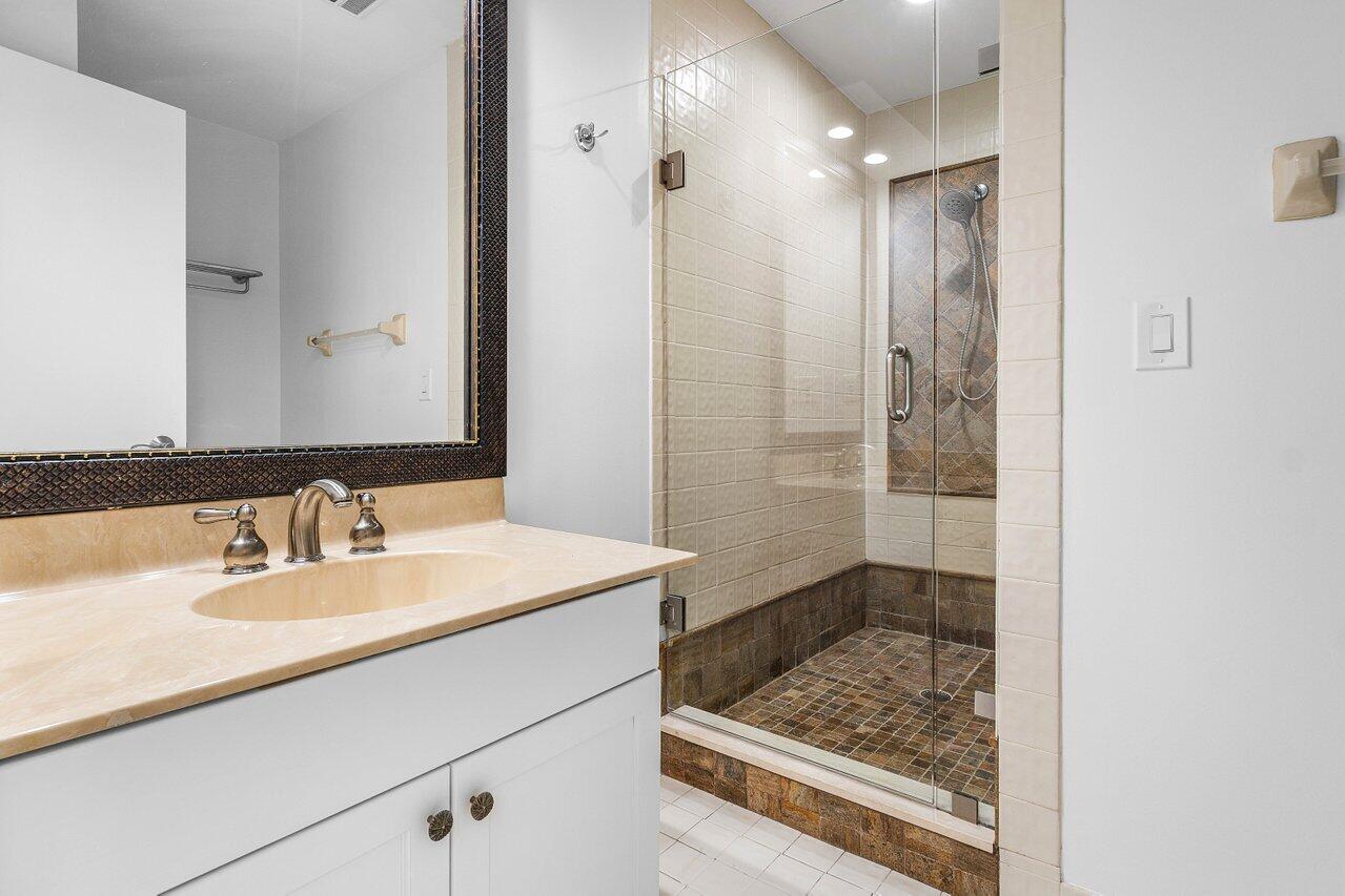 5109 North Ocean Boulevard, Unit H Ocean Ridge, FL 33435 - Photo 31 of 45 a bathroom with a sink and a mirror