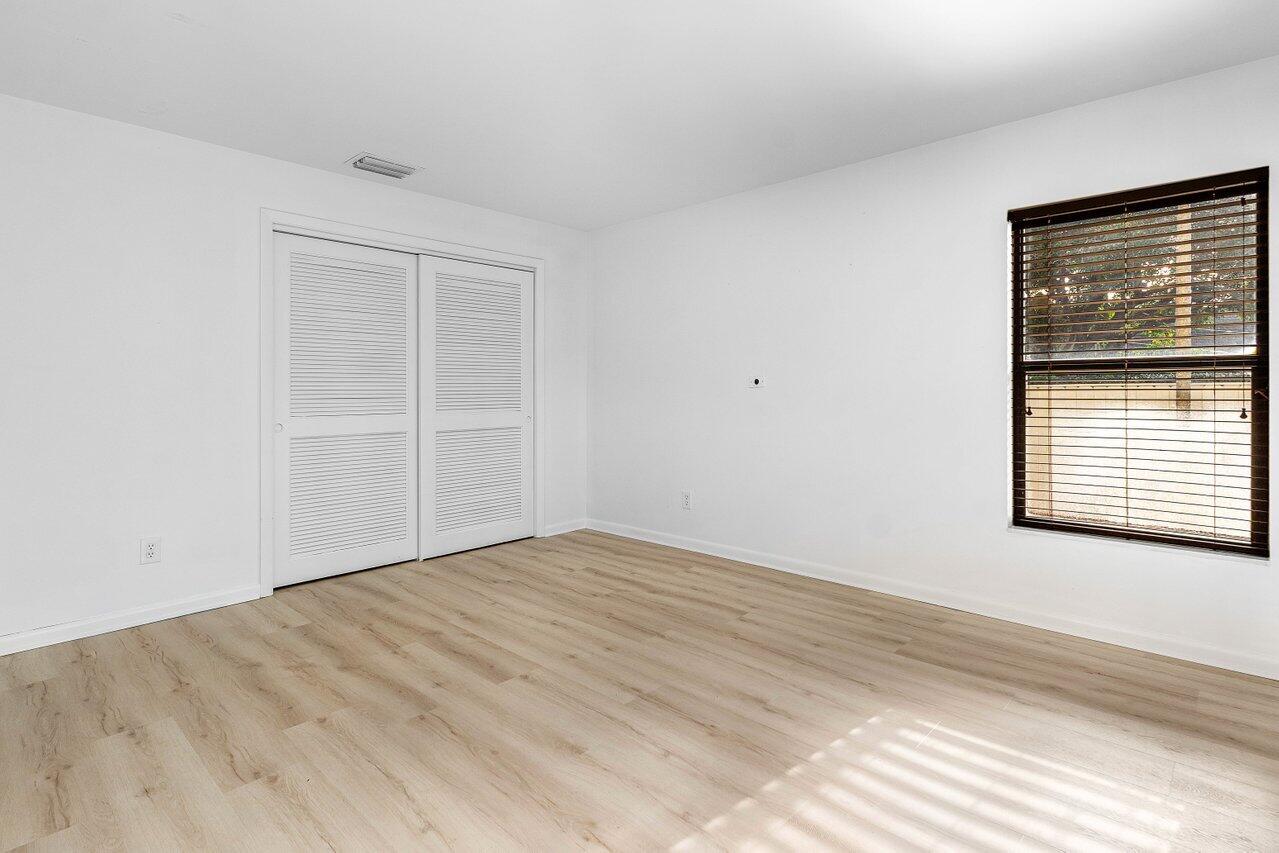 5109 North Ocean Boulevard, Unit H Ocean Ridge, FL 33435 - Photo 32 of 45 a view of an empty room with a window