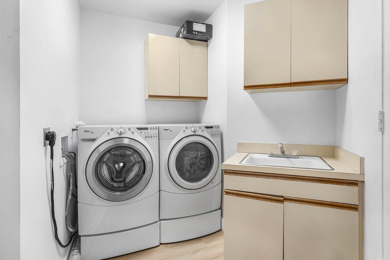 5109 North Ocean Boulevard, Unit H Ocean Ridge, FL 33435 - Photo 36 of 45 a utility room with sink dryer and washer