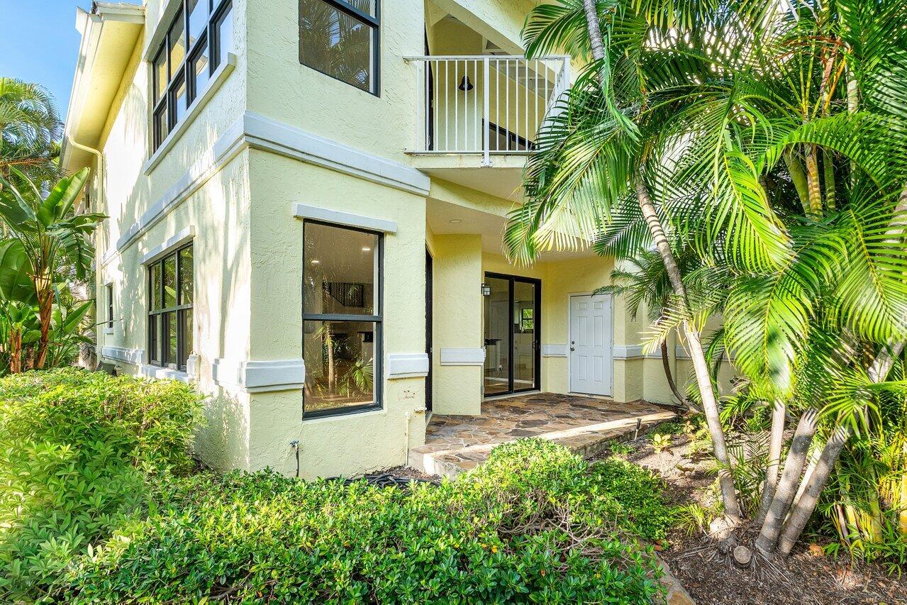 5109 North Ocean Boulevard, Unit H Ocean Ridge, FL 33435 - Photo 37 of 45 a view of a house with a flower garden